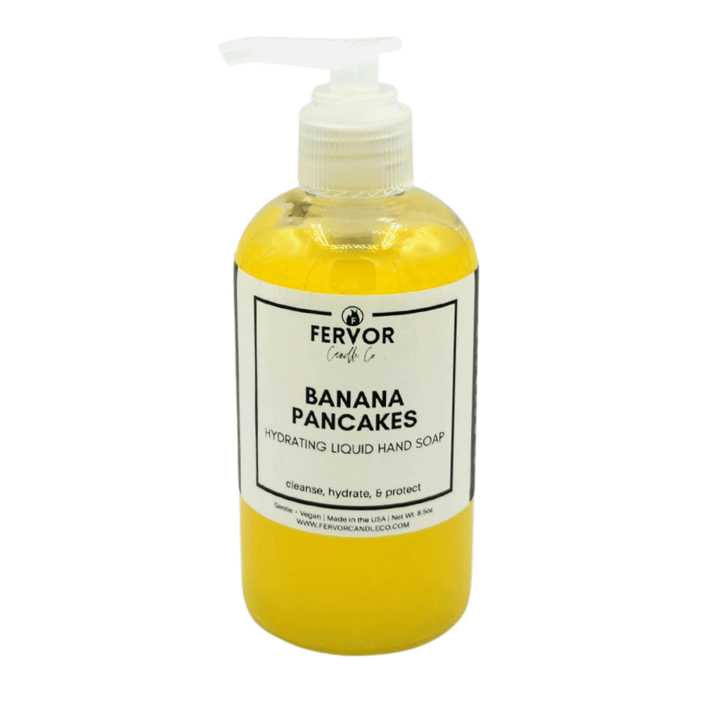Fervor Candle Company Banana Pancakes Hydrating Liquid Hand Soap product photo. Clear round plastic bottle with white plastic re-lockable saddle pump top, filled with vibrant yellow moisturizing liquid hand soap..