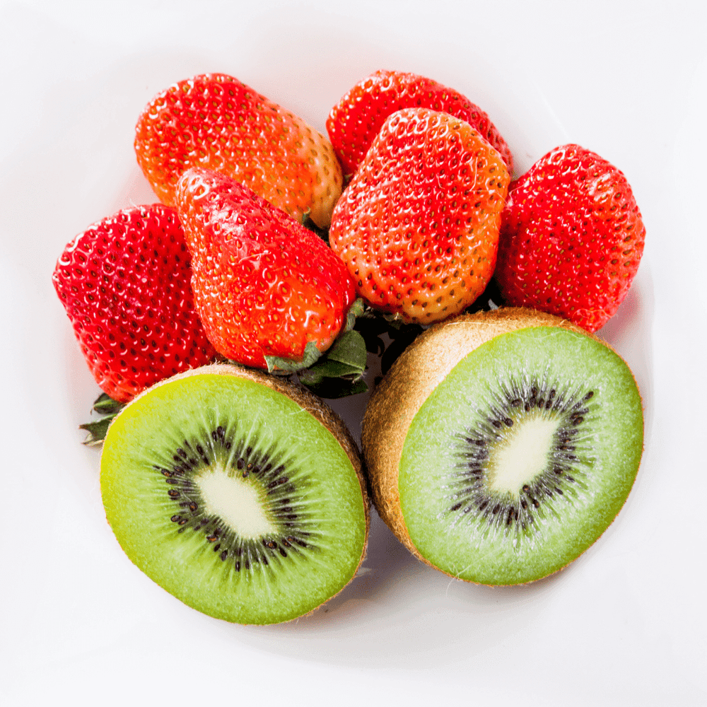 Berry Blast Hydrating Liquid Hand Soap by Fervor Candle Company scent inspiration photo. Six juicy ripe strawberries and a sliced-in-half kiwi fruit against a white background.